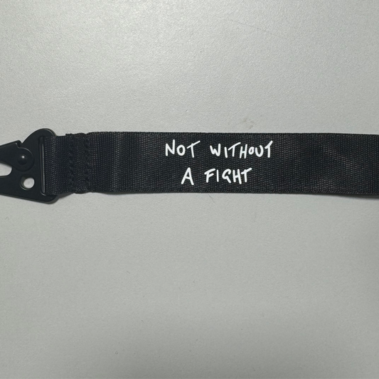 Daniel Ricciardo “Not without a fight” inspired wristlet keychain.